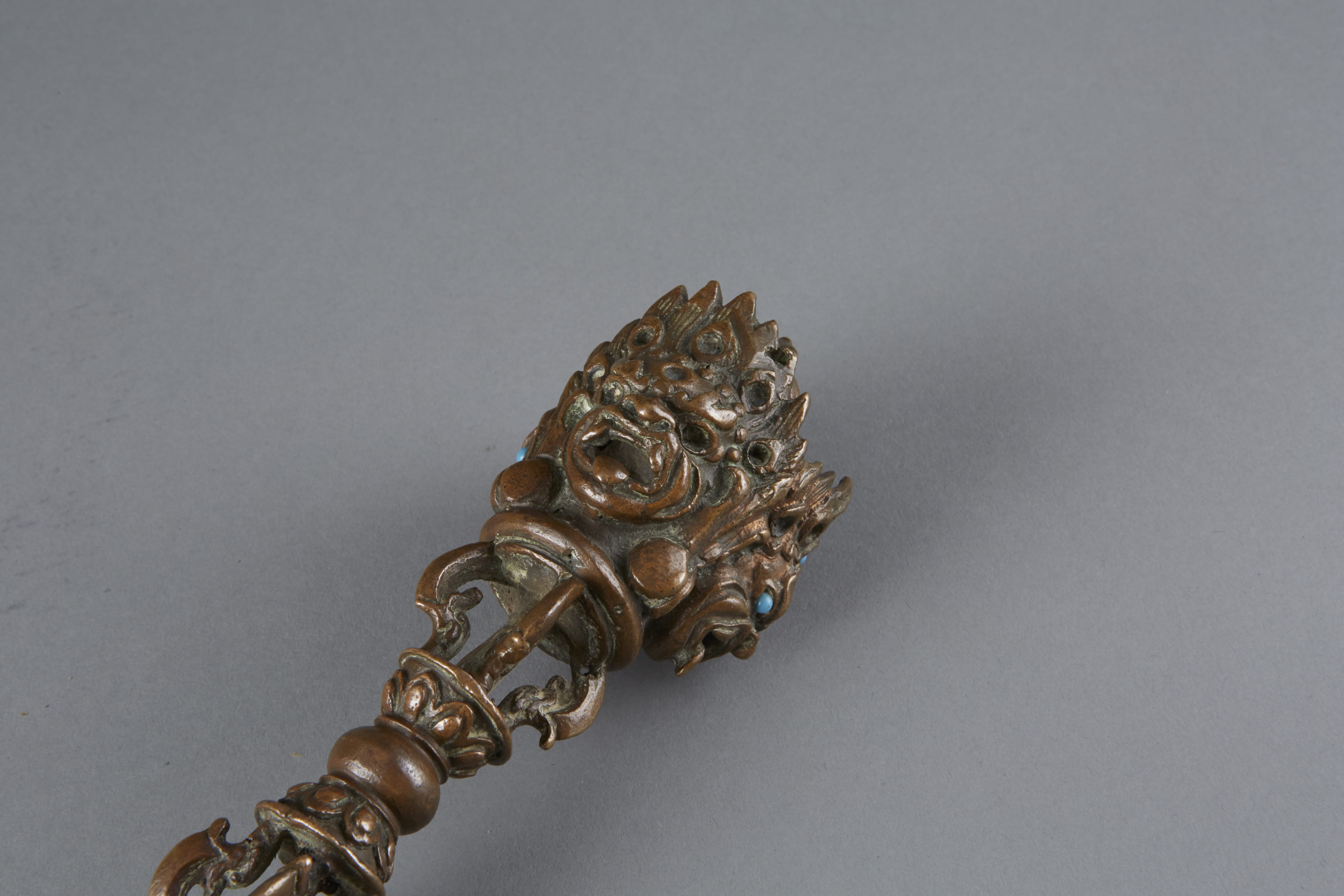 Lot 011: 18th Century Tibetan Bronze and Copper Phurba Inlaid with Turquoise