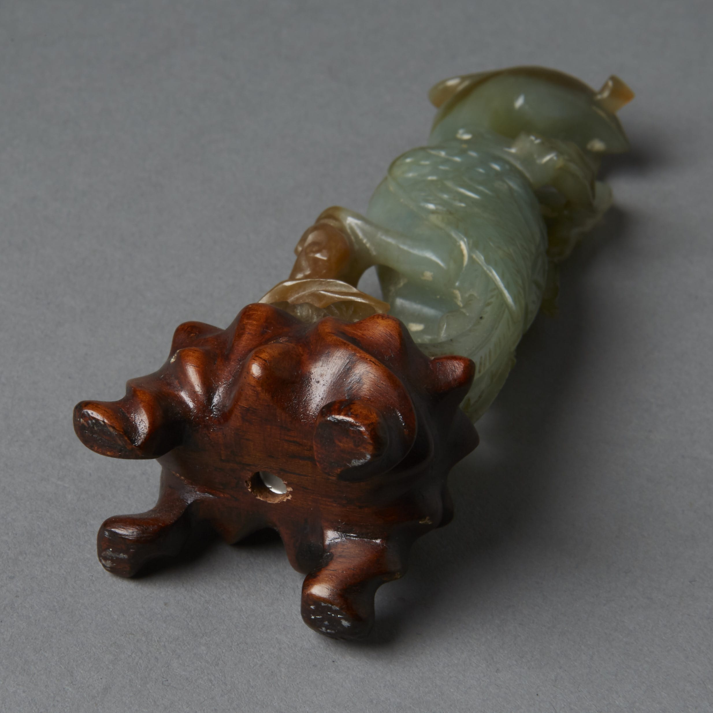 Lot 019: Chinese 19th century green Jade Carving of a Phoenix on Carved Wood Stand