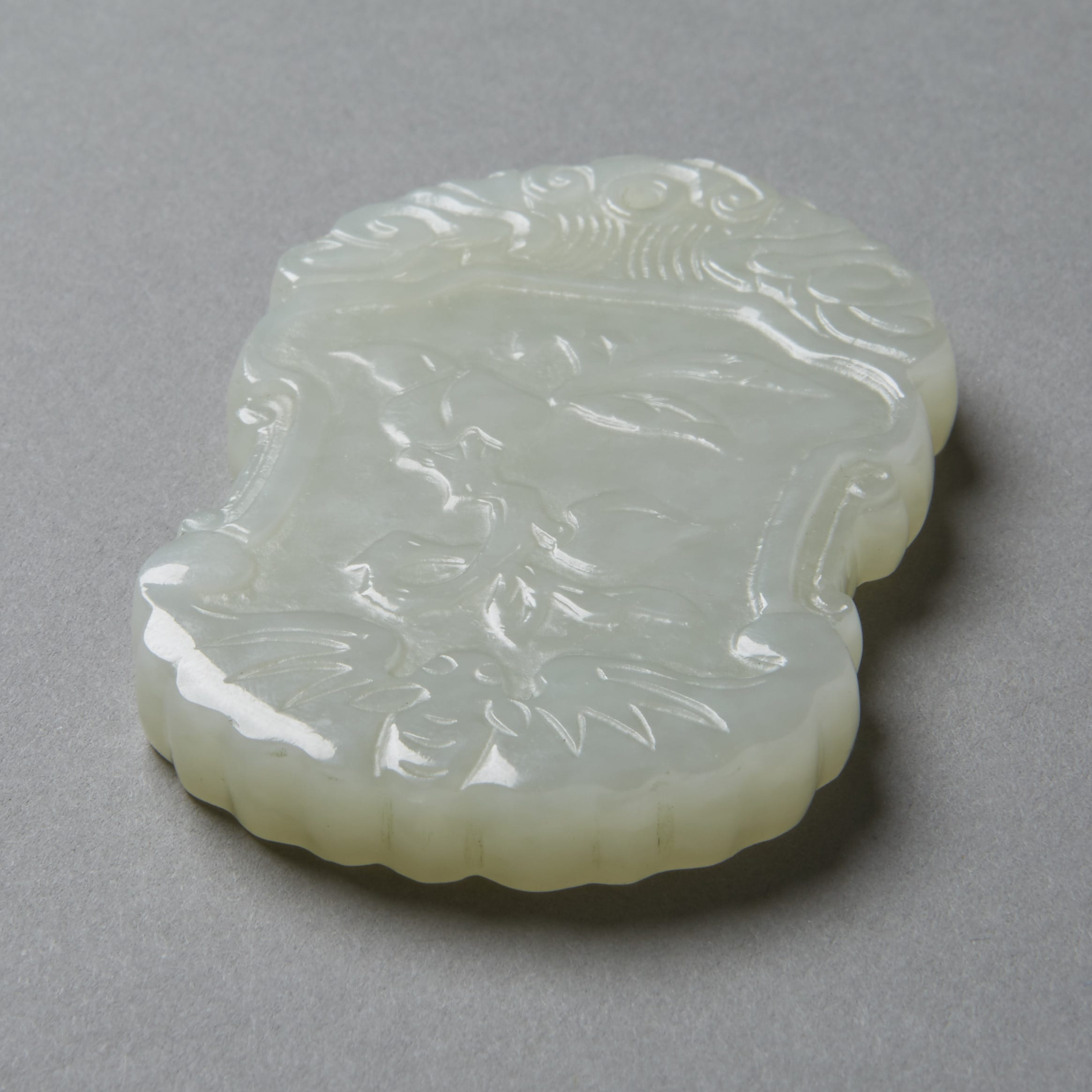 Lot 020: Chinese Late Qing pale celadon-white Jade Pendant with Blossoms and Seal Mark