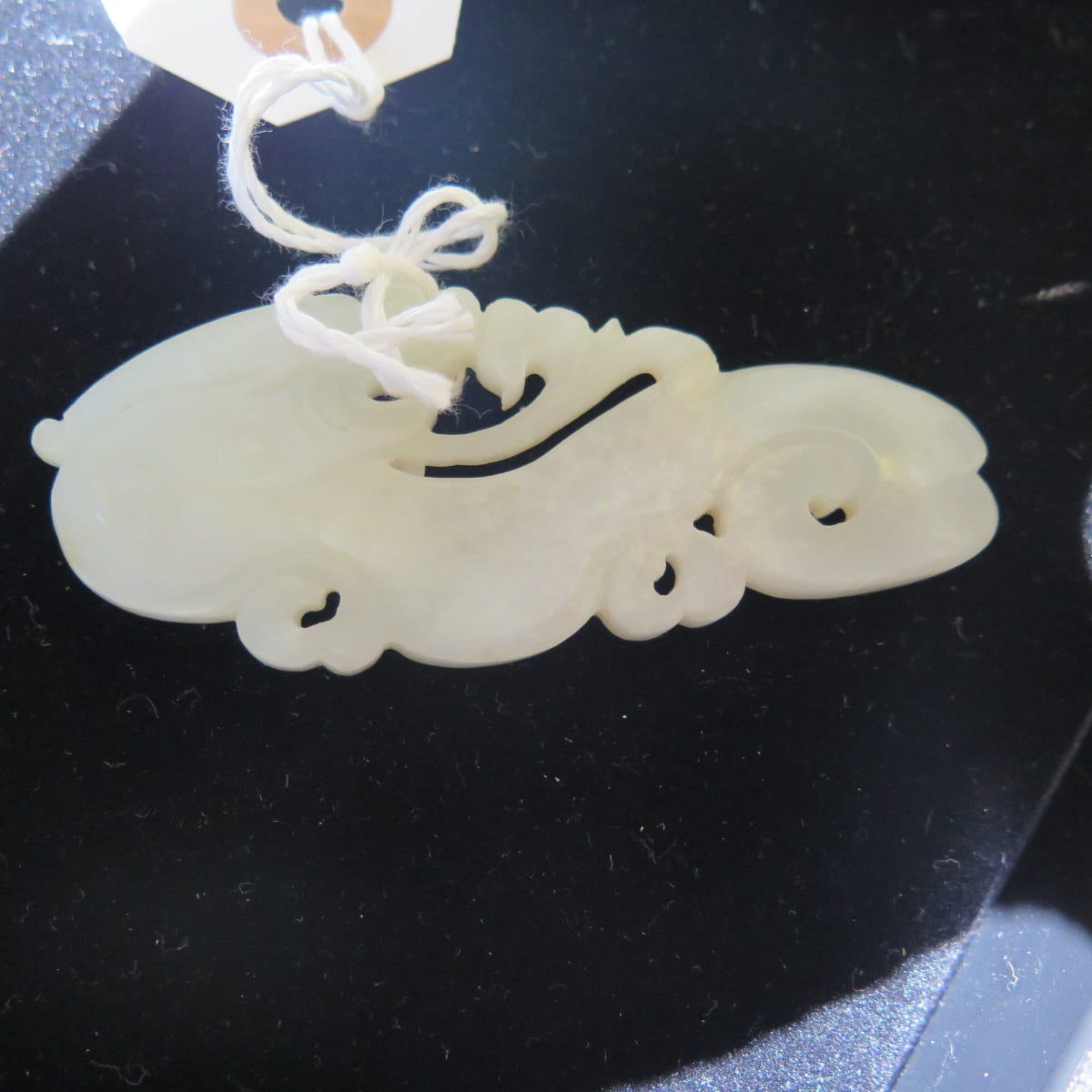 Lot 017: Group of 2: Chinese pale green Jade Pendant with a Dragon and a Silver Pin with carved Jade Fruit