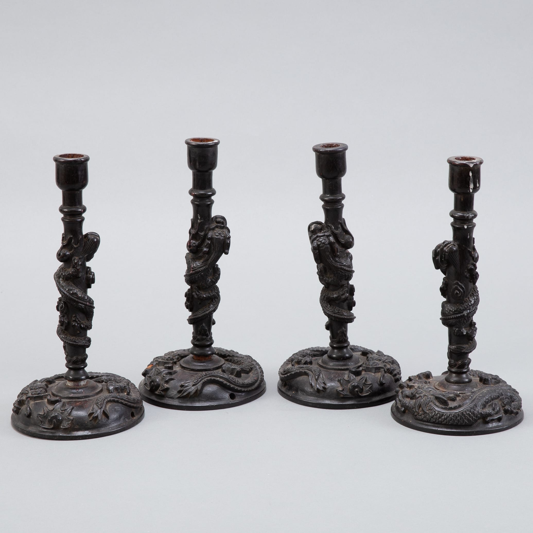 Lot 280: Set of 4 Chinese Dragon Rosewood Candlesticks