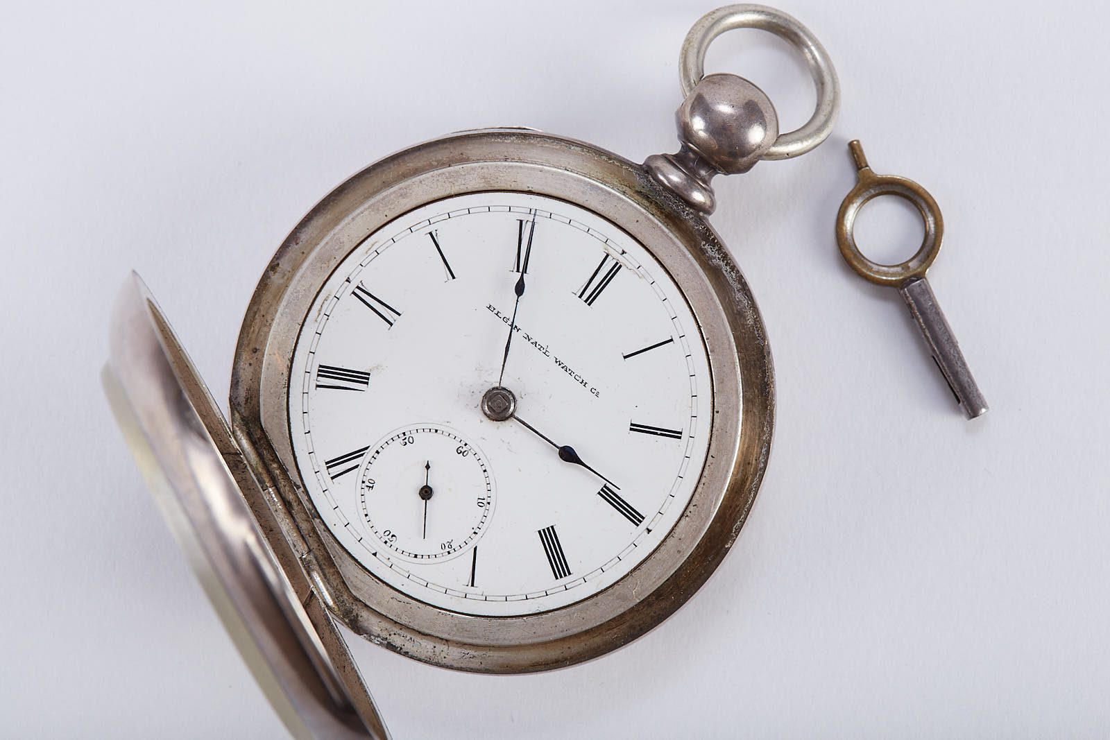 Lot 193: Elgin "Coin" Large Pocket Watch with Key