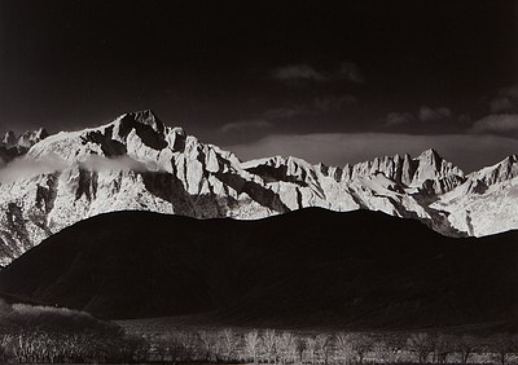 Ansel Adams black-and-white photograph of the snow-capped Sierra Nevada
