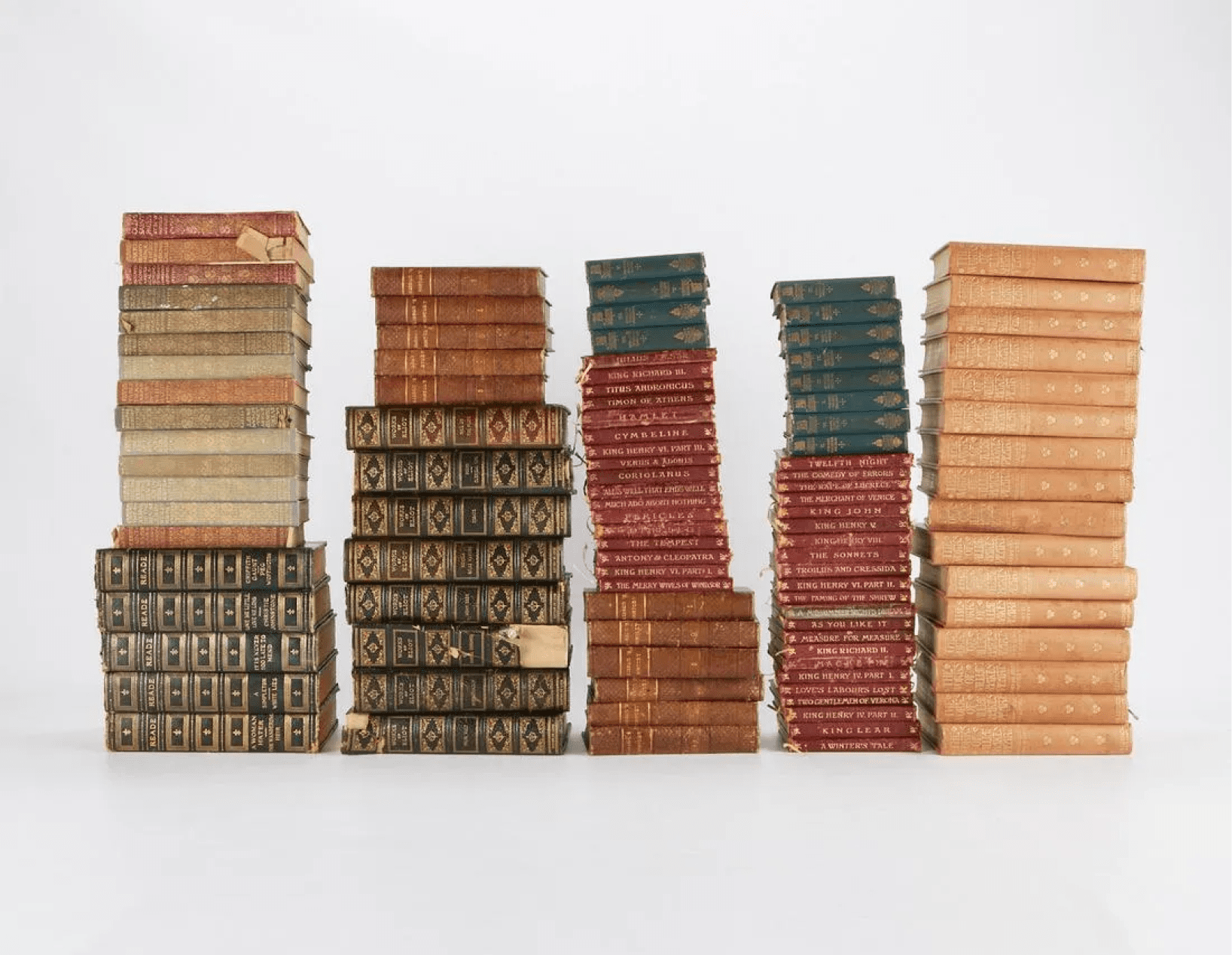 Stacks of antique leather-bound books