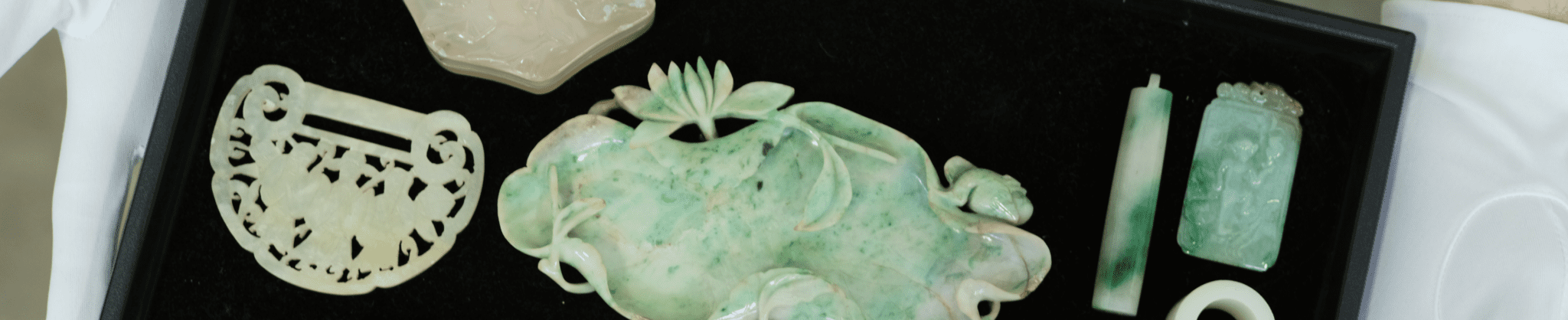 Carved Chinese jadeite pendants and toggles