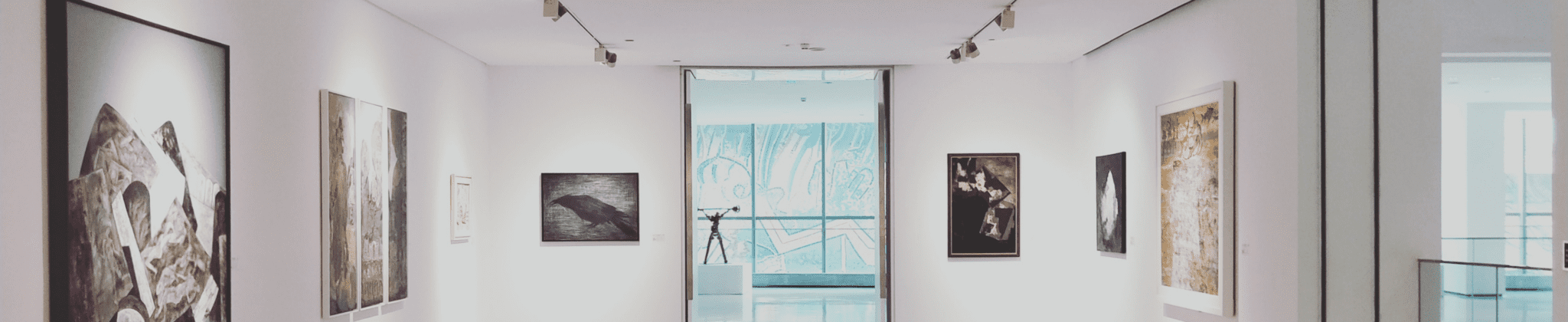 Fine-art gallery interior with framed works
