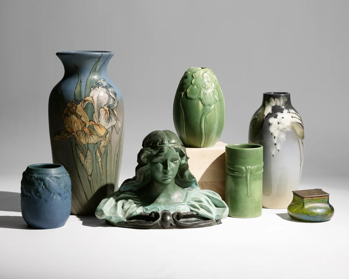 art-nouveau-pottery-vases-collection Art Nouveau ceramic vase collection with floral designs, green glazed pottery, and decorative sculptural pieces