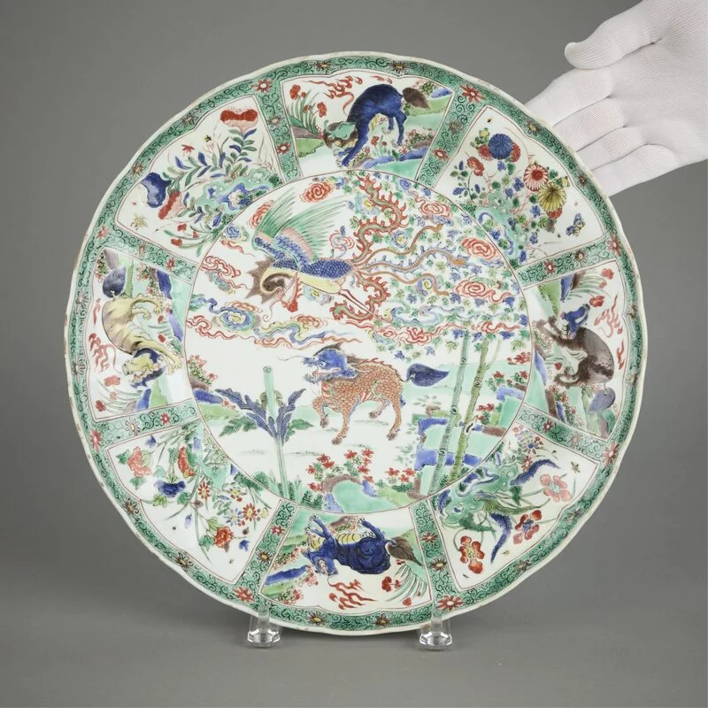 chinese-kangxi-famille-verte-charger Large Chinese Famille Verte porcelain charger densely painted with dynamic dragons and phoenixes among clouds.
